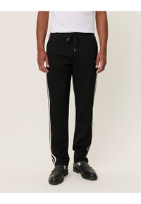 Les Deux STERLING TRACK PANTS - Calças de fato de treino - black/ivory