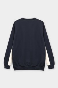 Navy blue sweatshirt with a crew neckline, ribbed cuffs, and hem. Features cream-colored accents on the sides. Soft, textured fabric.
