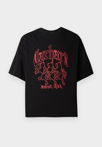 Czarna koszulka z krótkim rękawem wykonana z bawełny, z wyrazistą czerwoną grafiką przedstawiającą trzy figury lwów oraz napisem "Carhartt, Detroit, Mich."