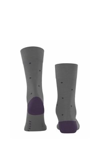 Calze grigie con pois viola e talloni rinforzati viola, posizionate in verticale per mostrare le caratteristiche del design anteriore e posteriore.