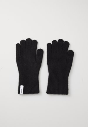 Black ribbed knit gloves with five finger openings and a small white tag on the wrist area. Soft texture.