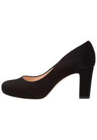 Black suede women's pump with round toe and moderate block heel on white background.