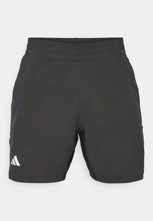 Czarne spodenki sportowe z lekkiego materiału, z elastycznym pasem, dwoma bocznymi kieszeniami i subtelnym wzorem tekstury.