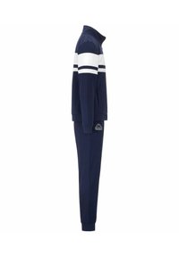 Tuta navy con colletto alto, caratterizzata da strisce orizzontali bianche nella parte superiore. Realizzata in tessuto morbido, include zip e dettagli con logo.