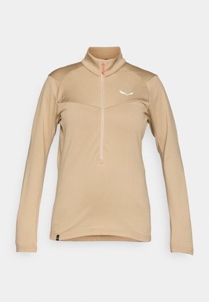 Bež majica s dolgimi rokavi, visokim ovratnikom, pol-zip zapiranjem spredaj, teksturirano blago, kontrastni naramnicami ter belim logotipom na prsih.