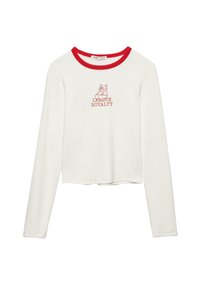 Valkoinen pitkähihainen lyhyt t-paita punaisella kaula-aukolla, jossa on karhukuva ja teksti "LEAGUE ROYALTY" punaisena. Pehmeä ja joustava kangas.