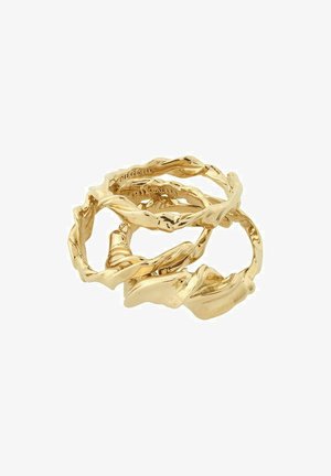 Gold-tone twisted rings stacked together, featuring a textured design with smooth and curved edges, creating an organic, flowing appearance.