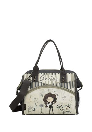 Borsa con design a tasti di pianoforte, una donna dei cartoni animati che canta, note musicali e testo che recita "Anekke" e "sing your soul".
