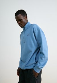 New Balance ATHLETICS 1/2 ZIP - Športni pulover - heron blue