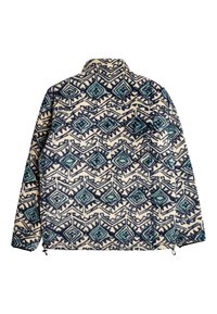 Fleecejacke mit einem cremefarbenen Hintergrund, versehen mit einem geometrischen Muster aus blauen und grünen Rauten. Hoher Kragen, seitliche Reißverschlüsse und weicher Stoff.