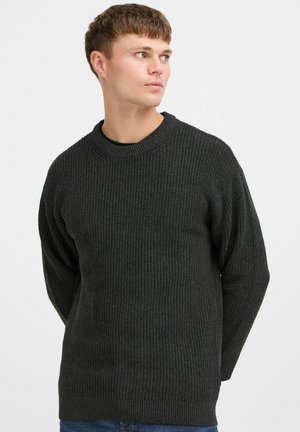 Dark gray ribbed knit sweater with a crew neckline and long sleeves. Soft texture and relaxed fit, featuring a subtle pattern throughout.