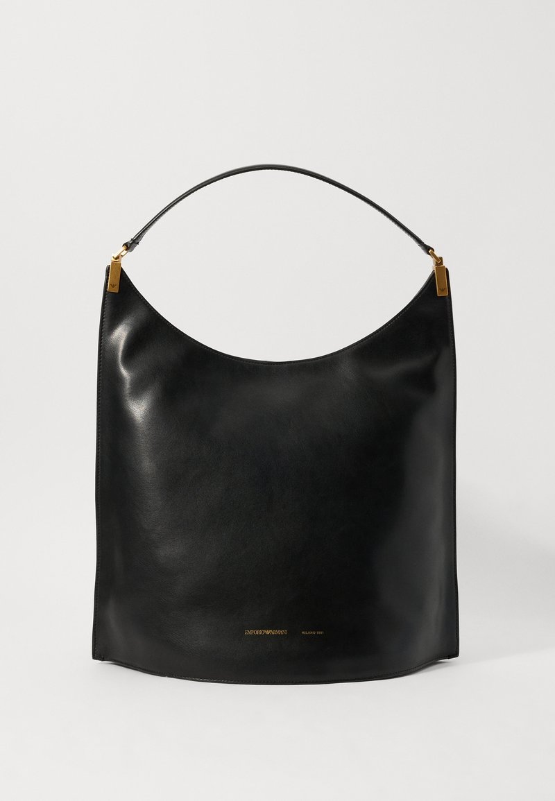 Black leather hobo bag with a curved silhouette, smooth texture, and a gold-tone logo detail at the bottom, featuring a slender shoulder strap.
