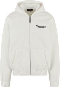 Hoodie zippé blanc avec deux poches avant. Comprend une capuche avec cordon de serrage et le logo "Dropsize" en broderie noire sur la poitrine gauche.