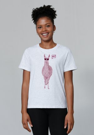 T-shirt en coton gris clair avec un graphique rose d'un lama portant des lunettes de soleil et une bulle de dialogue avec "Salut !". Manches courtes, col rond.