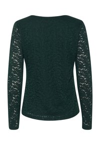 Mørkegrøn langærmet top lavet af blonder, med et blomster mønster og en glat, tekstureret krop. Rund halsudskæring og tætsiddende silhuet.