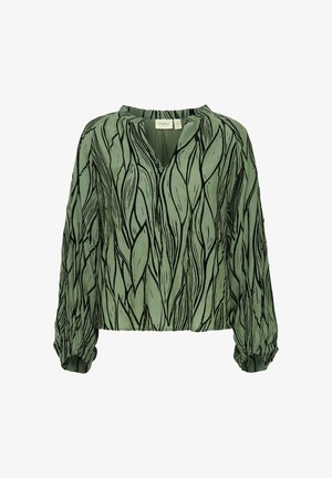 Grøn langærmet bluse med V-hals, der har et bladmønster i mørkegrøn og sort. Elastiske manchetter tilføjer tekstur og form.