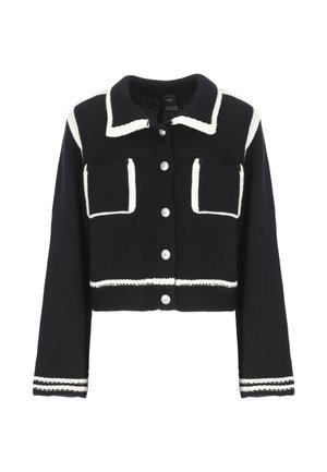 Cardigan cropped in maglina blu con dettagli bianchi, due tasche frontali e bottoni tondi in argento lungo la chiusura e i polsini.