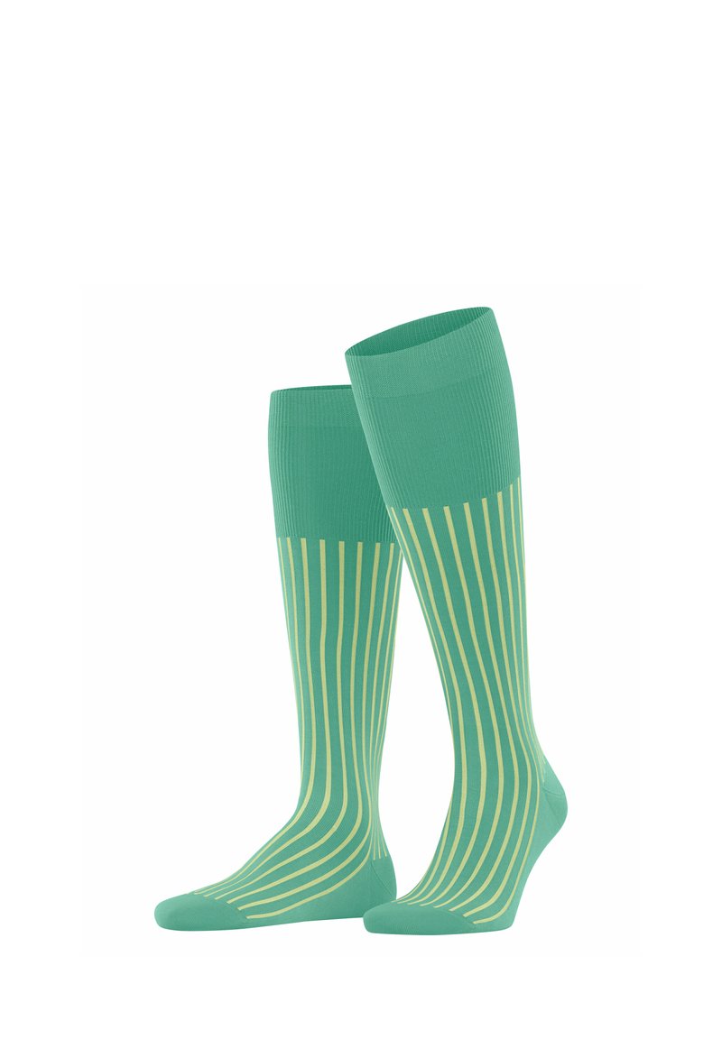 Calze alte fino al ginocchio in verde menta con sottili righe verticali gialle. Realizzate in un tessuto morbido ed elasticizzato per comfort e vestibilità.