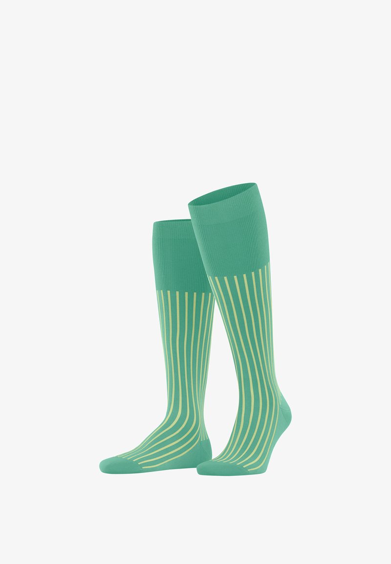 Calze alte fino al ginocchio in verde menta con sottili righe verticali gialle. Realizzate in un tessuto morbido ed elasticizzato per comfort e vestibilità.