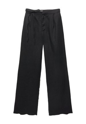 Pantalons larges noirs avec taille à cordon, texture subtile et détails de plis, fabriqués dans un tissu léger.