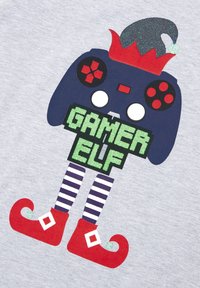 Graphic features a cartoon character shaped like a game controller with a red and green elf hat, striped legs, and red shoes with white accents.