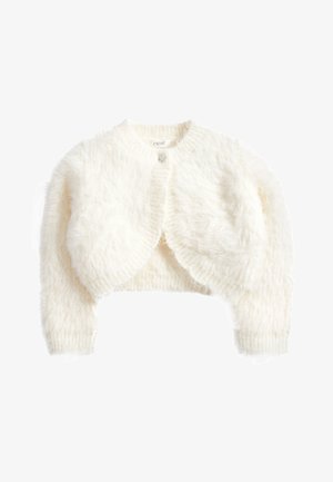 Bílý zkrácený kardigan s fluffy texturou, kulatým výstřihem a dlouhými rukávy. Zapíná se vpředu jedním dekorativním knoflíkem.