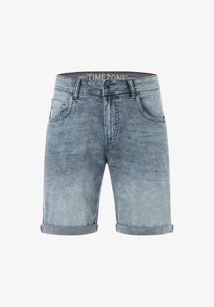 Light blue rolled-hem denim shorts with front button, zipper, belt loops, and front pockets, branded "TIMEZONE" inside the waistband.