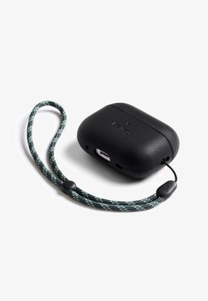 Black wireless earbud charging case with built-in USB-C port and attached green and grey patterned wrist strap loop.