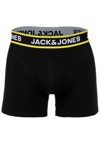 Svarta bomullboxershorts med en bred elastisk midjeband som har gul och vit branding. Utformade med en figurnära form och sömdetaljer.