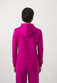Puma LOGO HOODIE - Kapucnis pulóver - magenta gleam