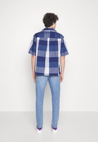 Levi's® 512™ SLIM TAPER - Calças de ganga justas - medium indigo worn in
