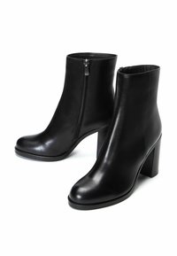 Black leather ankle boots with a smooth texture, rounded toes, and a 3-inch block heel. Features a side zipper for easy wear.