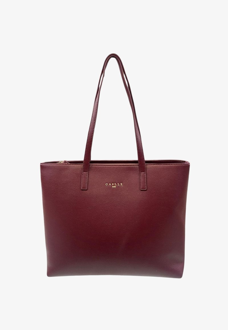 Borsa tote in pelle di un rosso scuro con due lunghe cinghie e un piccolo logo dorato "GAËLLE PARIS" posizionato al centro, vicino alla parte superiore.