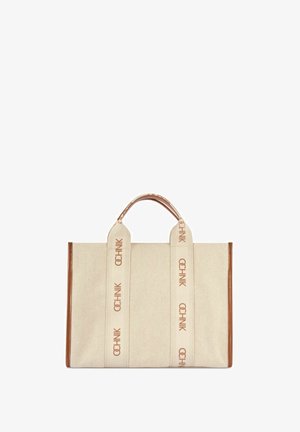 Beżowa płócienna torba typu tote z brązowymi skórzanymi krawędziami, wyposażona w dwa szerokie uchwyty z nadrukiem "OCHNIK" w brązowych literach.