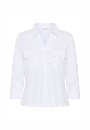 Witte blouse met knopen, driekwart mouwen en twee voorste borstzakken met knopen, voorzien van een puntkraag.