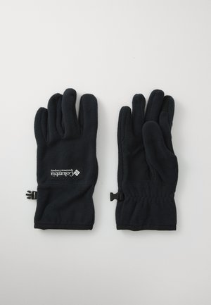 Sorte fleece-hansker med elastiske håndledninger og Columbia Sportswear Company-logo på baksiden av en hanske, liggende flatt på en hvit overflate.