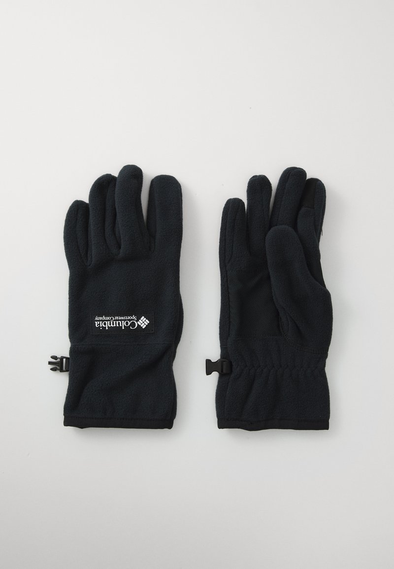 Sorte fleecehandsker med elastiske håndled og Columbia Sportswear Company logo på bagsiden af den ene handske, lagt fladt på en hvid overflade.