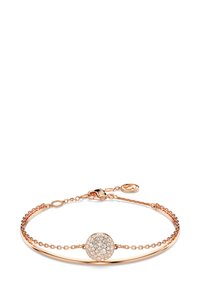 Pulsera de oro rosa con un charm circular. El charm está engastado con pequeños cristales transparentes, con una cadena delicada y un cierre.