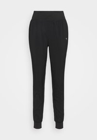 Schwarze Sporthose mit weichem Stoff, ausgestattet mit einem elastischen Bund und zulaufenden Beinen. Logo-Akzent auf der linken Vorderseite.