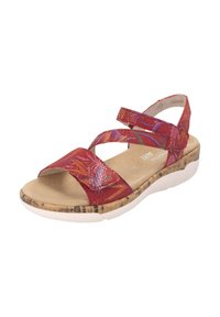 Sandales rouges avec des lanières croisées, motif texturé, semelle intérieure douce et base en liège. Dotées d'une semelle en caoutchouc blanc et d'un soutien de cheville.