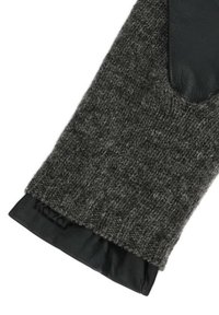 Knitana rokavica iz temno sive volne s črno usnjeno dlanjo. Ima rebrasto teksturo in gladek usnjen manšeta z rahlim logotipom.