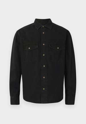 Black button-up shirt made of cotton. Features a collar, two chest pockets, and front button closure. Long sleeves with buttoned cuffs.