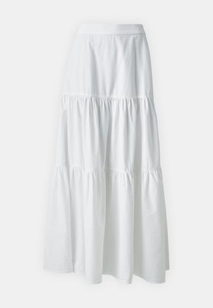 Biała, bawełniana spódnica maxi z warstwowym przeszyciem, elastycznym pasem i miękką teksturą. Charakteryzuje się zwiewnym fasonem i marszczeniami przy każdej warstwie.