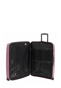 Purple hard-shell suitcase with a telescopic handle, four wheels, black interior compartments, zippered pockets, and textured fabric lining.
