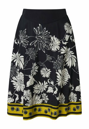 Gonna nera a trapezio con ampie stampe floreali bianche e bordo giallo decorato con pois neri lungo l'orlo.