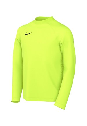 Jasna neonowo-żółta sportowa koszulka z długim rękawem z czarnym logo Nike Swoosh na piersi, prezentowana na białym tle.