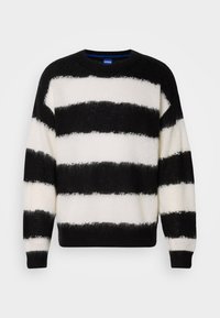 Pull en maille floue noir et blanc avec larges rayures horizontales, col rond et manches longues, de la marque Hugo.