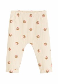 Krämfärgade, ribbade leggings med ett återkommande mönster av bruna björnar som bär röda hattar, med vikta muddar vid anklarna.
