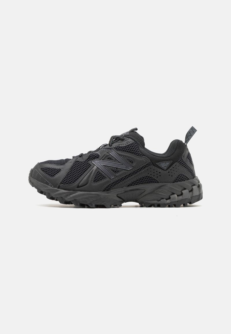 Black athletic shoe with mesh upper, rubber sole, and textured accents. Features a lacing system and pull tab for easy wear.