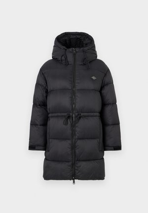 Black puffer jacket with a hood, zip closure, cinched waist, and elastic drawstrings. Smooth texture with ribbed cuffs and a logo patch.